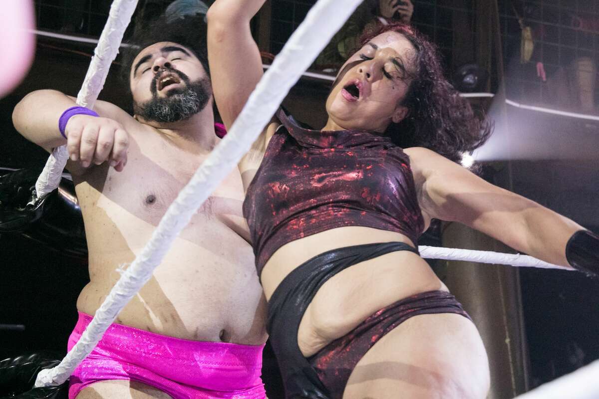 Wrestler Britany Wonder, right, hits competitor Thicc Martel during a Hoodslam match at DNA Lounge in San Francisco on Aug. 22, 2021.