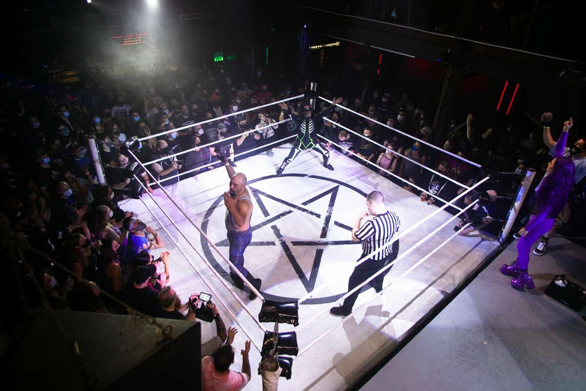 Left to right, wrestlers Johnny Butabi and El Chupacabra face off at Hoodslam's return, which took place at DNA Lounge in San Francisco on Aug. 22, 2021.