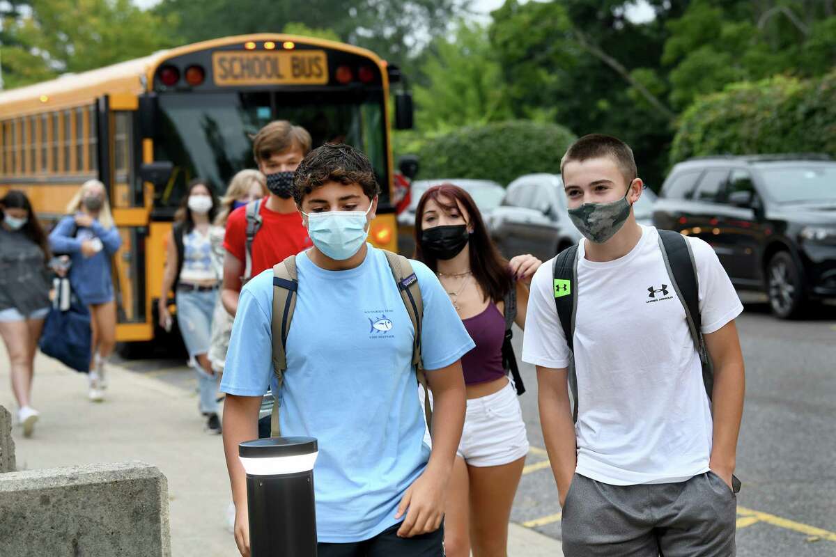 Students arrive for the first day of school at Fairfield Ludlowe High School in Fairfield, Ct., Monday morning, August 30, 2021.