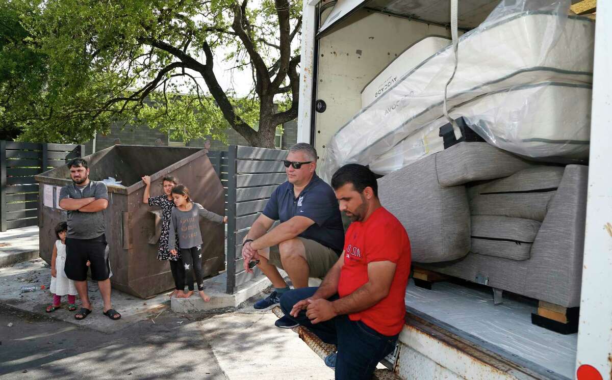 VetStrong founder and Afghanistan War veteran James Pobanz waits for information to know what apartments will be getting beds at Wurzbach Manor apartments on Saturday, Aug. 28, 2021. Waiting with Pobanz is Mohammad Khan.