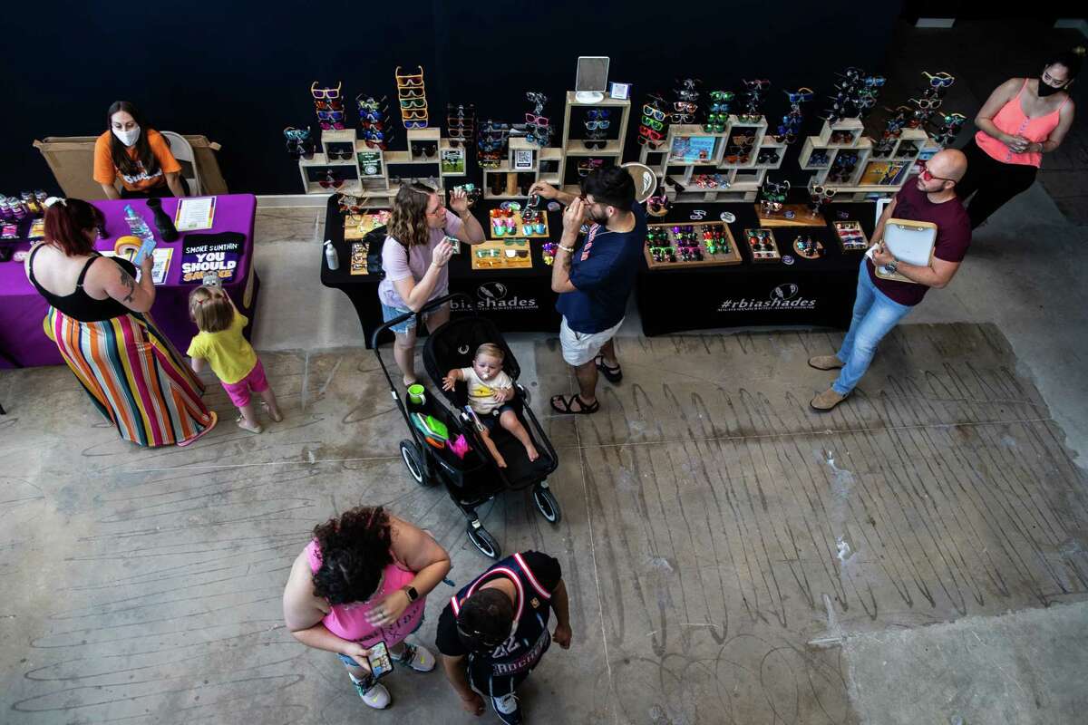 People shop at the Railway Heights Market during the soft opening, Saturday, Aug. 21, 2021, in Houston.