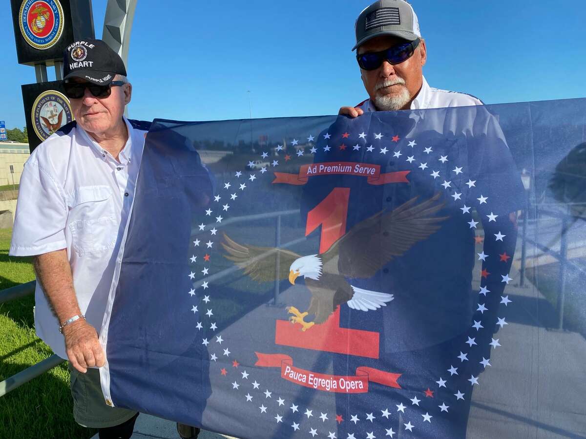 Montgomery County Memorial Veteran's Commission Chairman Jimmie Edwards III designed a flag to honor first responders. Each element of the flag has special symbolism. The flag flies at the Montgomery County Veteran's Memorial Park in Conroe. Pictured from left are Edwards and Director of Procurement Floyd Stewart.