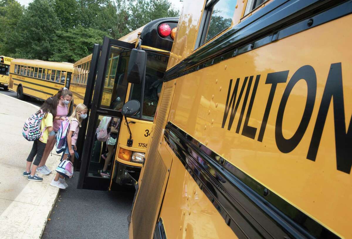 Cider Mill Students head to their buses after the first day of school on Monday, August 30, 2021, in Wilton, Connecticut