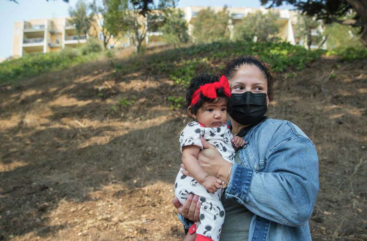 Rosa Baltobano, poses for a portrait with her daughter Sofia. Baltobano has been a resident in the Diamond Heights neighborhood since the ’90s. She opposes the controversial proposal to build 24 townhomes on the hillside next to the affordable housing where she lives with her family.
