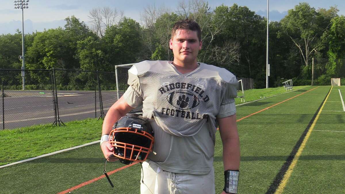 Ridgefield High School football player Cameron Smith poses for a portrait on Monday.