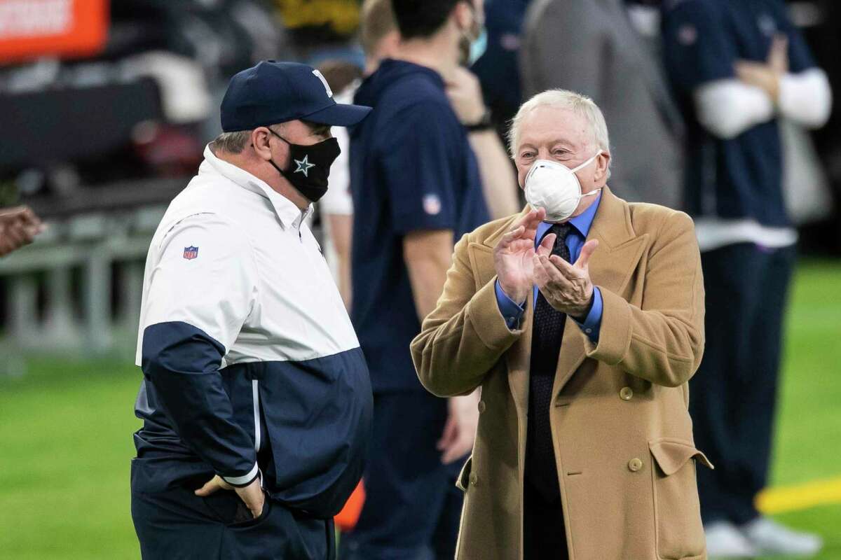 Cowboys owner Jerry Jones talks to head coach Mike McCarthy before a game against the Vikings on Nov. 22, 2020 in Minneapolis.