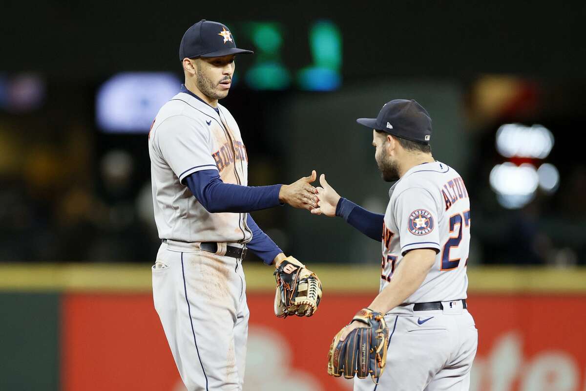 Seattle Mariners starting pitcher Chris Flexen gets a hug from