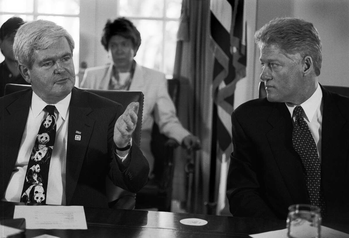 President Bill Clinton listens as House Speaker Newt Gingrich gives his thoughts on the continuing budget talks before a session with the rest of the congressional leadership on Dec. 30, 1995.