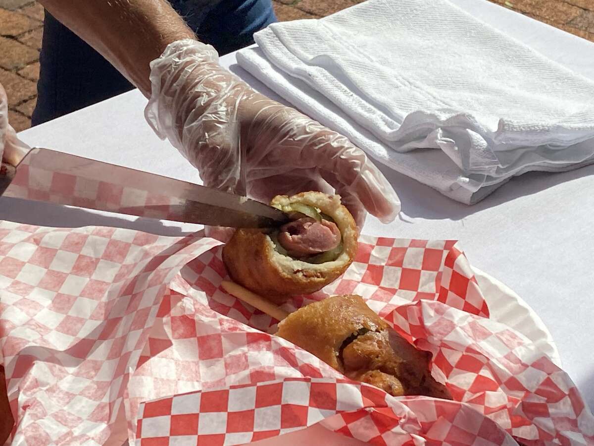 The Meatball Factory's Dilly Dilly Dog features a bacon-wrapped hot dog stuffed into a cored-out pickle, dipped into corn dog batter and fried. 