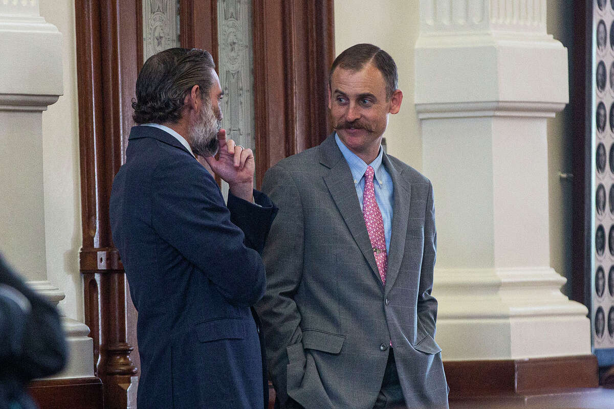 State Rep. Andrew Murr, R-Junction, converses with colleagues on the floor of the House of Representatives at the Capitol in Austin, Texas on Tuesday, Aug. 31, 2021. The Texas House on Tuesday approved a sweeping measure that would put new limits on how and when Texans can vote and make it a crime for election judges to obstruct partisan poll watchers. (Mikala Compton/Austin American-Statesman via AP)