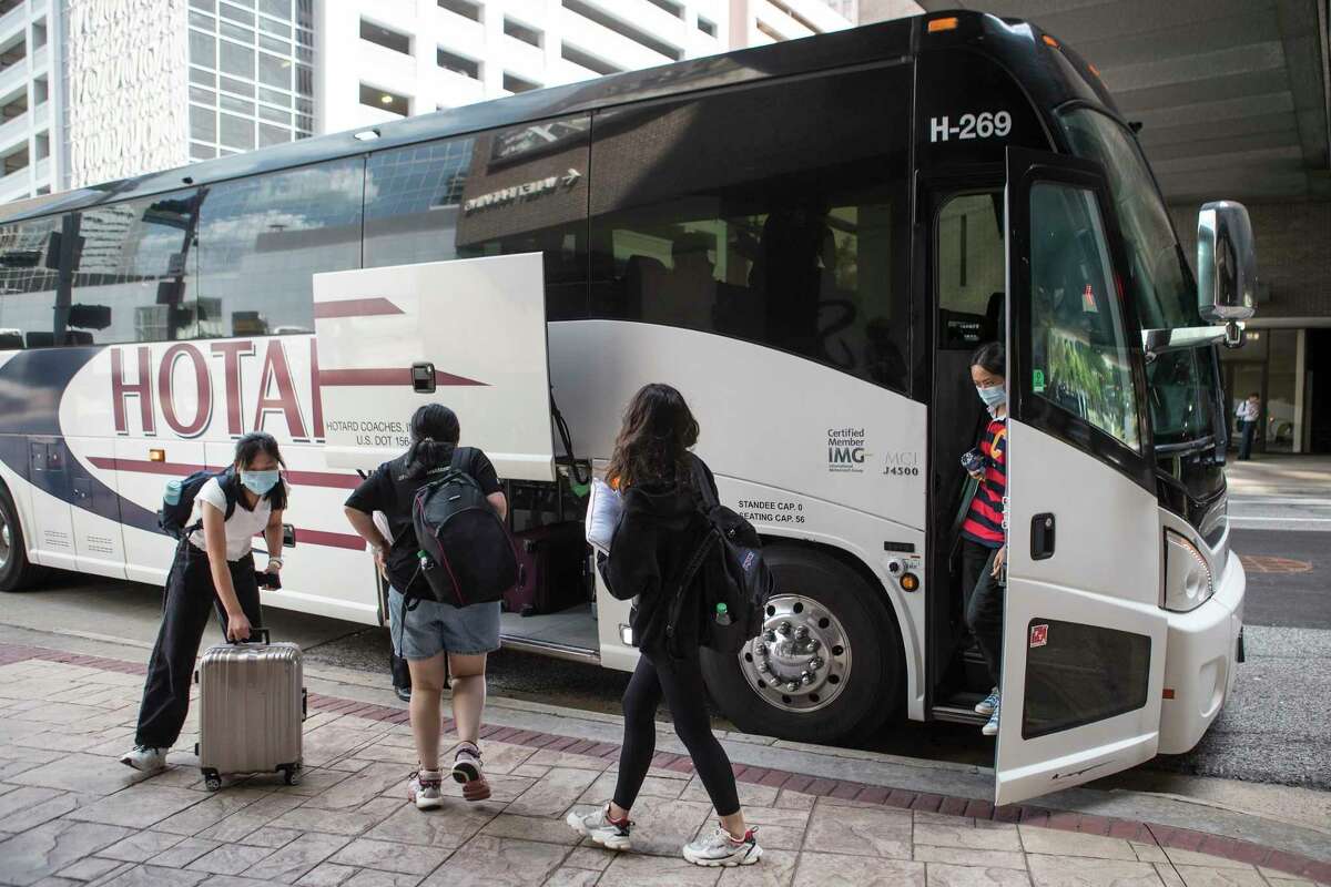 A group of international students from Tulane University are dropped off at the downtown Hyatt after evacuating New Orleans in the aftermath of Hurricane Ida Tuesday, Aug. 31, 2021 in Houston. A total of 1,841 Tulane students were ferried in 35 buses to Houston.