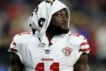 Santa Clara, California, USA. 18th Oct, 2020. San Francisco 49ers wide  receiver Brandon Aiyuk (11) celebrates touchdown with team member in front  of TV screen on Sunday, October 18, 2020, at Levis