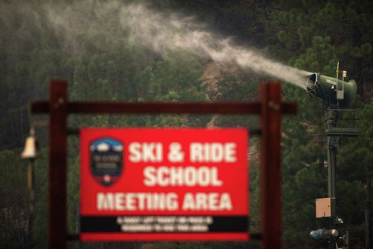 Snow machines saturate vegetation Tuesday to help protect Heavenly Mountain Resort in South Lake Tahoe from the approaching Caldor Fire.