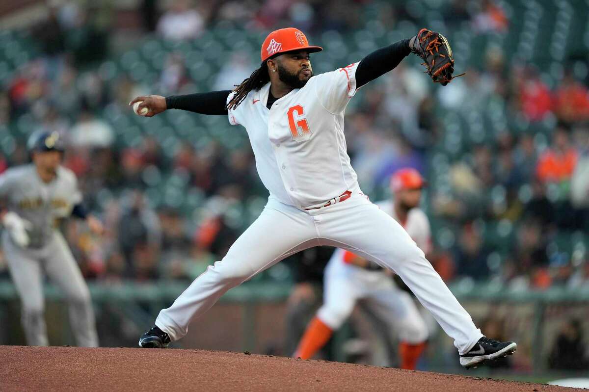 San Francisco Giants pitcher Johnny Cueto pitches against the Milwaukee Brewers during the first inning of a baseball game Tuesday, Aug. 31, 2021, in San Francisco. (AP Photo/Tony Avelar)