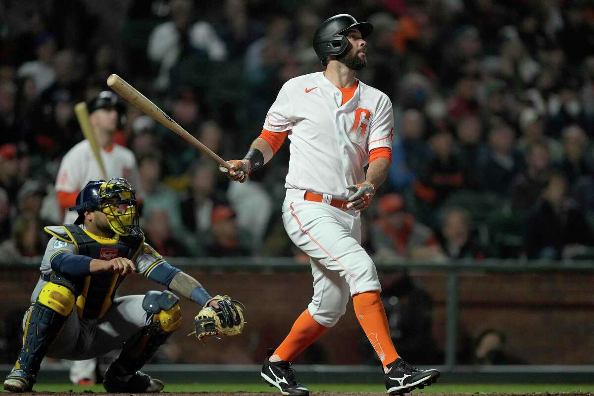 San Francisco Giants' Brandon Belt (9) hits a solo home run against the Milwaukee Brewers during the sixth inning of a baseball game Tuesday, Aug. 31, 2021, in San Francisco. (AP Photo/Tony Avelar)
