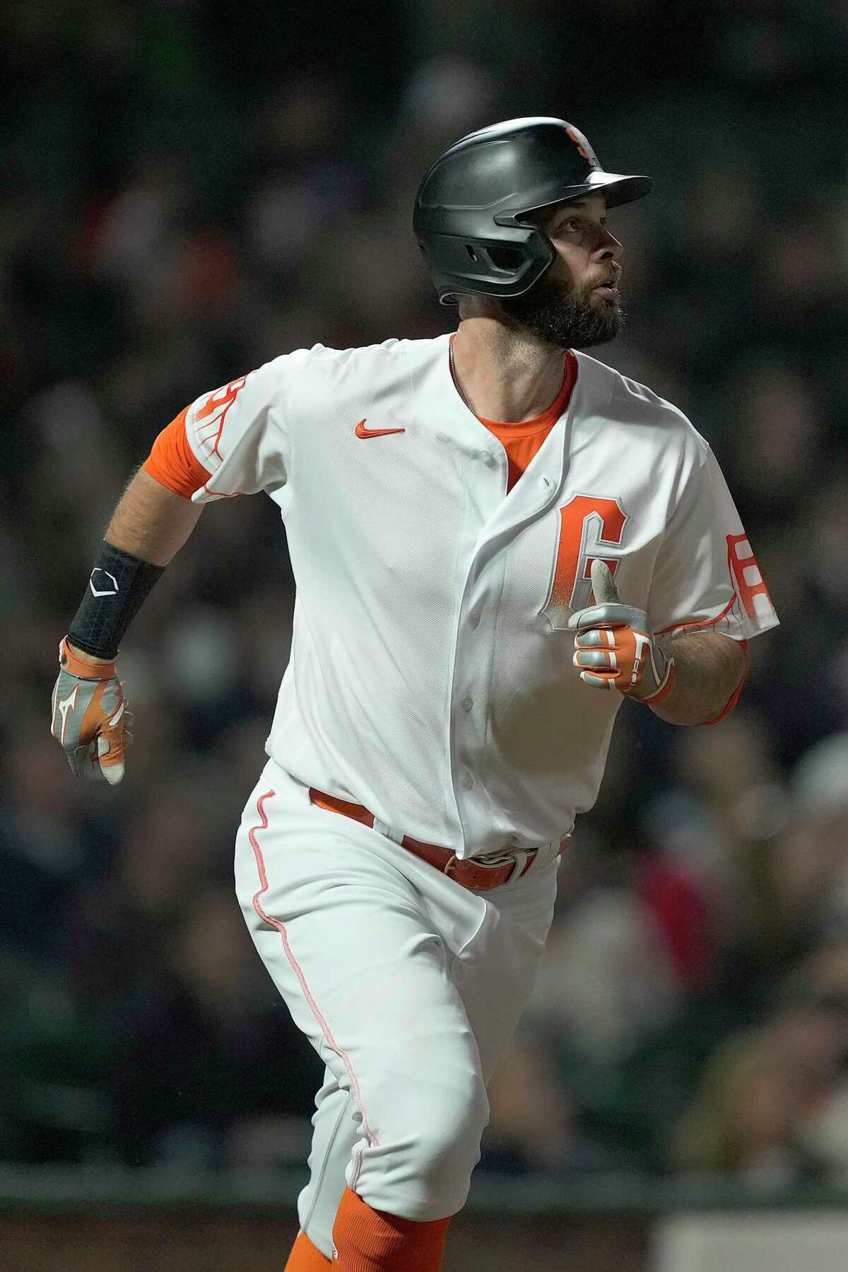 San Francisco Giants' Brandon Belt watches his solo home run against the Milwaukee Brewers during the sixth inning of a baseball game Tuesday, Aug. 31, 2021, in San Francisco. (AP Photo/Tony Avelar)