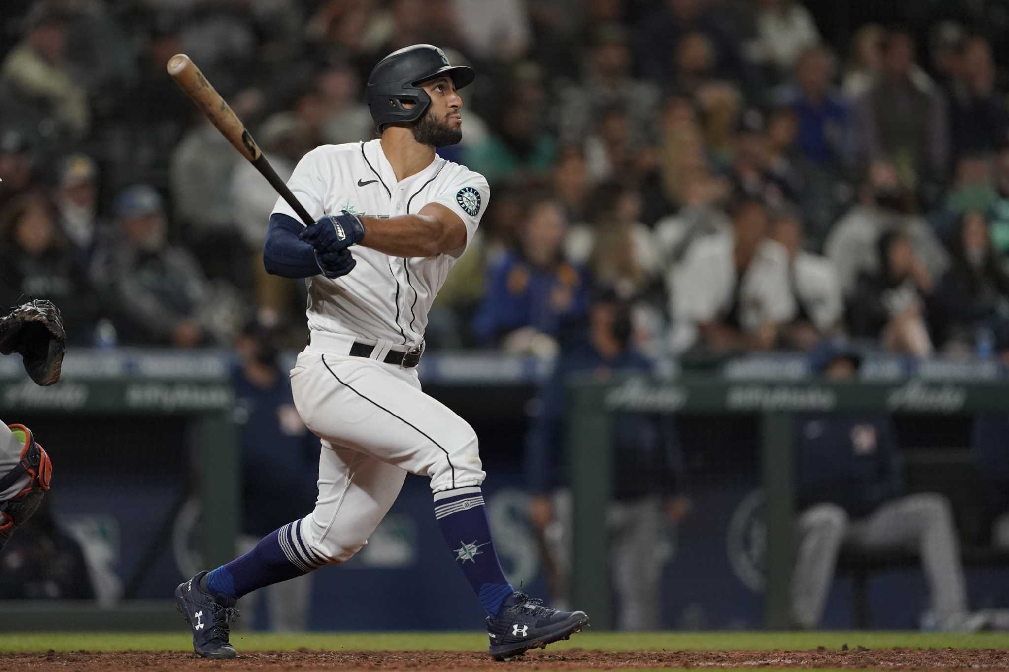 Seattle Mariners third baseman Abraham Toro, left, gets the ball to late as  Houston Astros runner Kyle Tucker (30) safely steals second base during the  eighth inning of a baseball game Monday