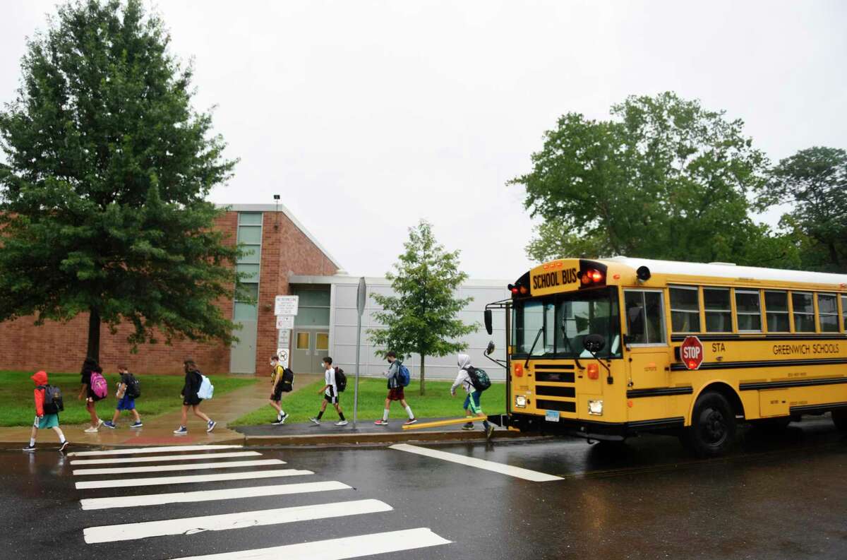 Students enter school on the first day of the 2021-2022 school year at Western Middle School in Greenwich, Conn. Wednesday, Sept. 1, 2021. Greenwich Public Schools students across all grade levels returned for in-person learning Wednesday.
