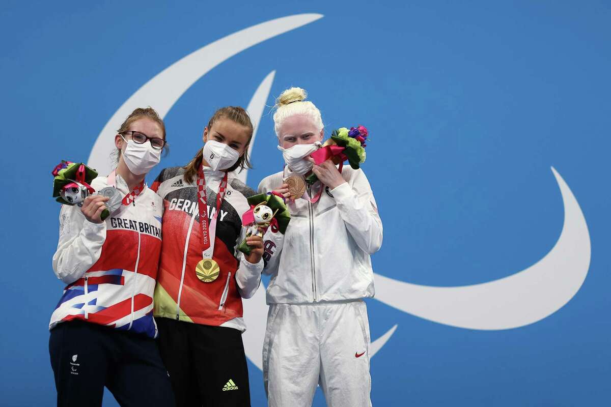 Left to right, silver medalist Rebecca Redfern of Team Great Britain, gold medalist Elena Krawzow of Team Germany and bronze medalist Colleen Young of Team United States pose during the Women’s 100m Breaststroke SB13 medal ceremony on Day Eight of the Tokyo 2020 Paralympic Games at Tokyo Aquatics Centre on Wednesday in Tokyo.