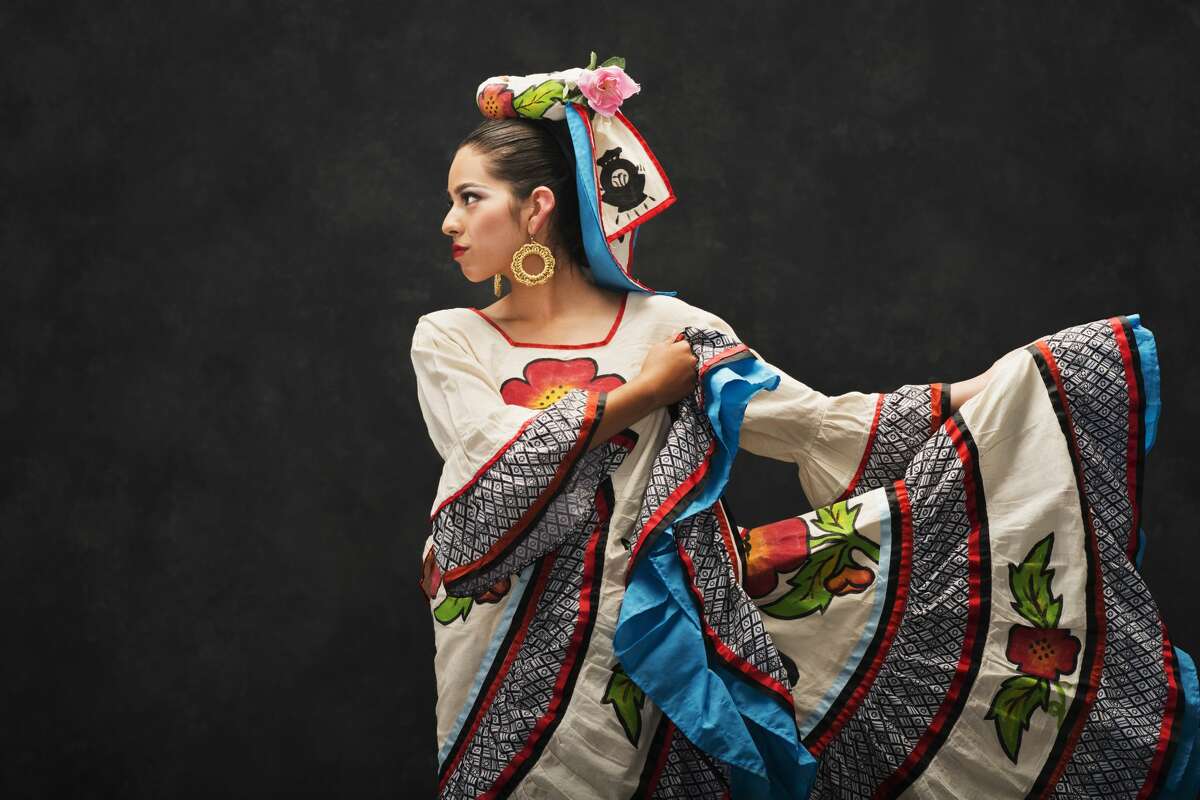 FILE — A Hispanic teenage girl dances in Sinaloa Folkloric dress.