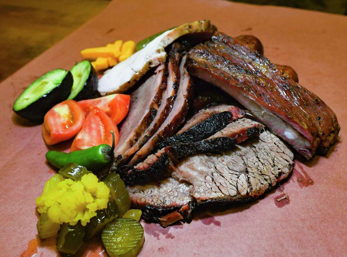 Kreuz Market serves up a delicious barbecue combination that includes classic brisket, sausage and ribs.