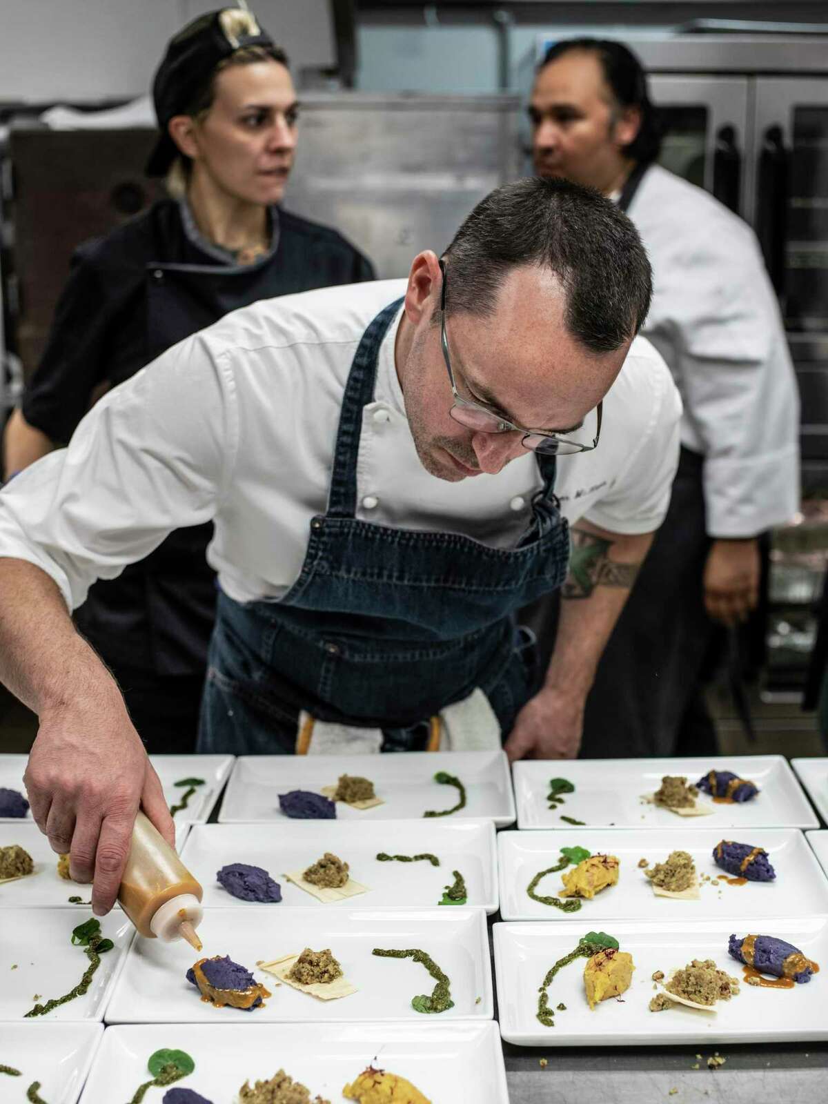 Chef Steve McHugh cooks during the San Antonio Restaurant Association's annual gala at the Witte Museum in 2018.
