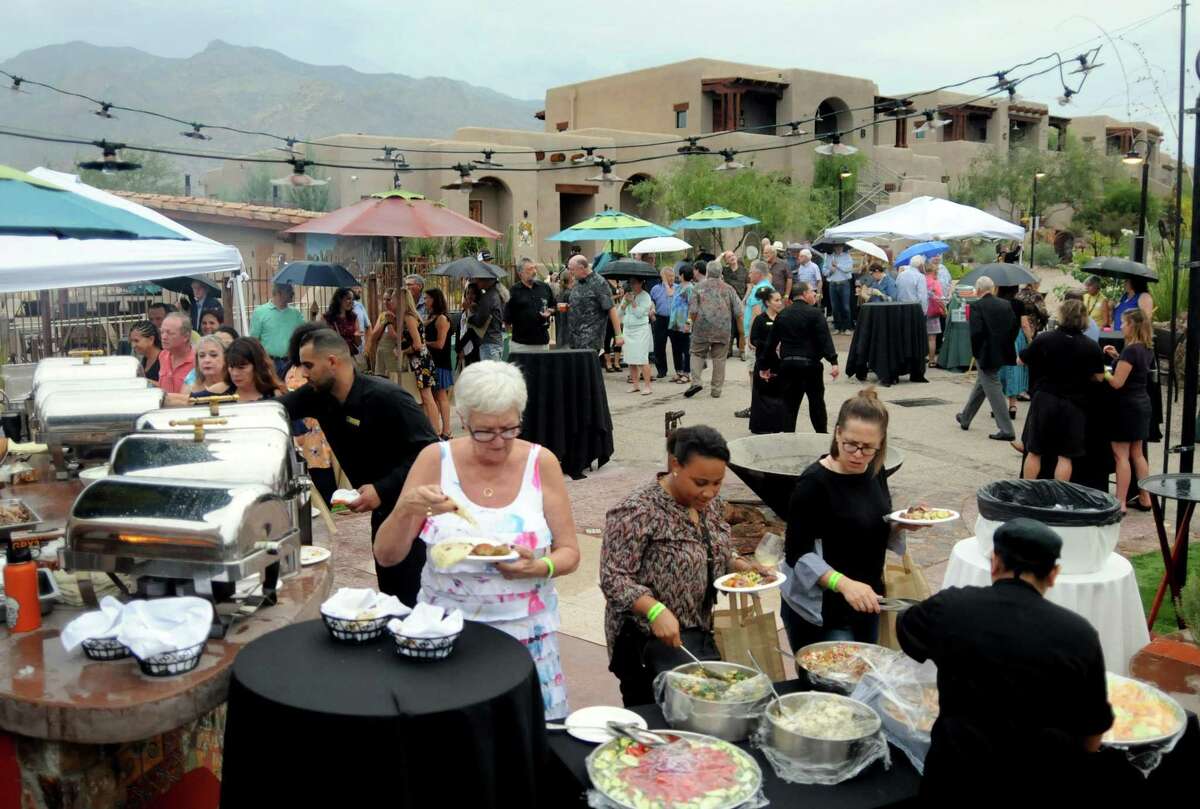 With the Santa Catalina mountain range in the background, guests fill their plates at the second annual Tucson Heritage Food & Wine Festival, one of several festivals to launch since the city's UNESCO Creative City of Gastronomy designation in 2015.