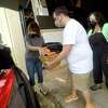 Volunteers with Love Thy Neighbor, including Donny Avery and Ramona Young, unload donations from Angela Baker during the first leg of Wednesday's donation drive to benefit Louisianans impacted by Hurricane Ida. Beaumont Communnity Players was one of three donation drop-off sites that ran through the day to collect needed supplies. Baker has family in Houma who evacuated ahead of the storm. and have to see the extent of their possible damage. Images from the region brought back memories of Hurricane Rita, which severely damaged Southeast Texas. Baker is especially glad to see relief efforts focusing on the small, most severely impacted areas, like her family's hometown. "I'm just grateful, because places like Houston and New Orleans, they get all the attention, but those small towns - they really need the help." Photo made Wednesday, September 1, 2021 Kim Brent/The Enterprise