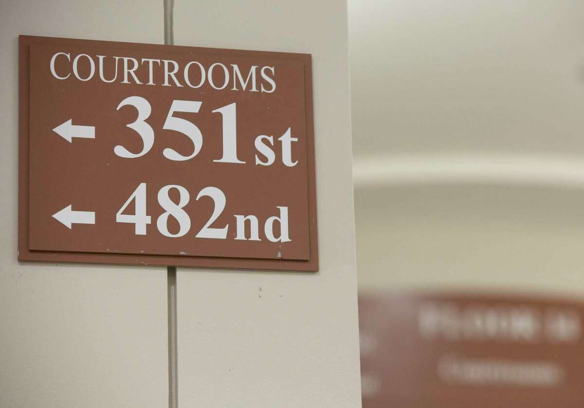 A sign on the hallway pointing the direction for the 482nd Judicial District Court Wednesday, Sept. 1, 2021, at Harris County Criminal Courts at Law in Houston. Wednesday was the first day of Harris County's newest felony court -- the first to open since the 1980s.