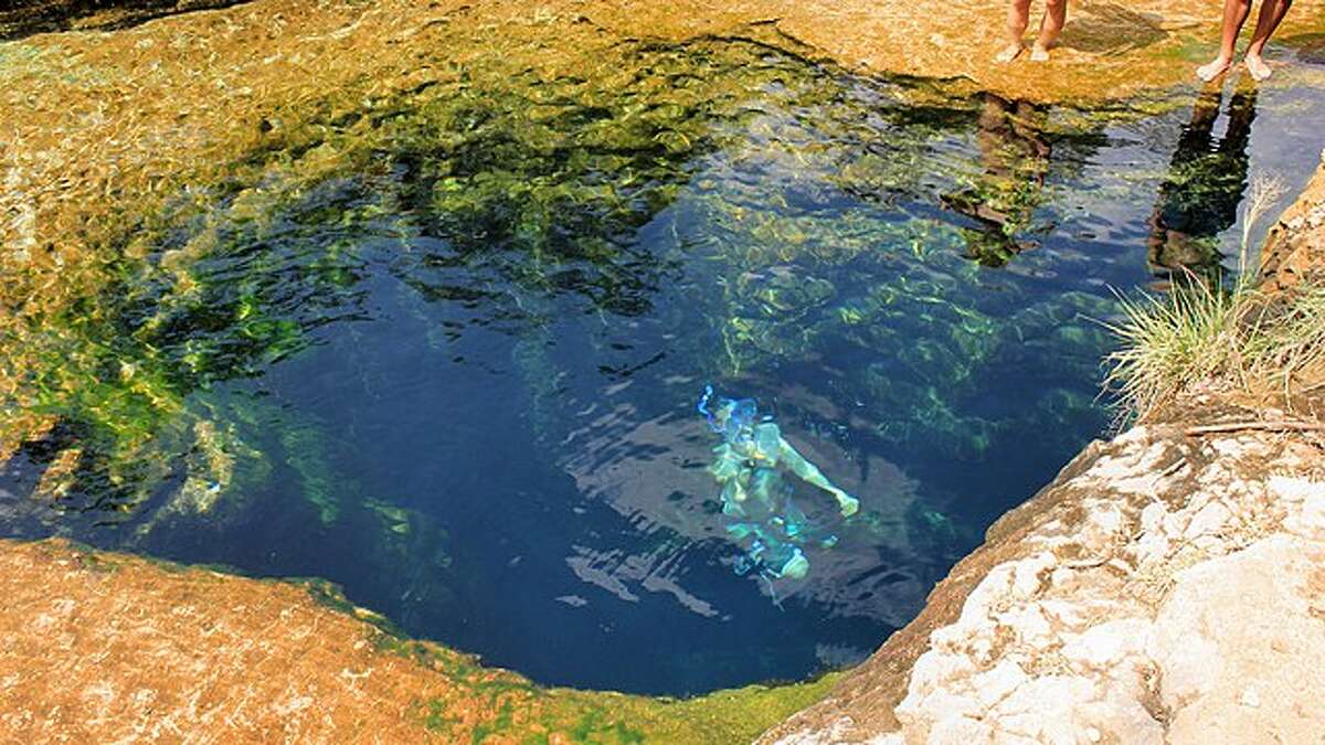 Explore the deep water hole which contains underwater caves.