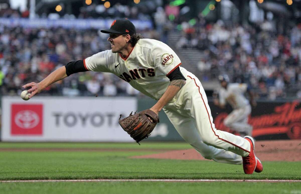 Kevin Gausman (34) throws home after fielding a bunt by Brewers pitcher Brett Anderson (24) getting Luis Urias (2) out at the plate in the second inning as the San Francisco Giants played the Milwaukee Brewers at Oracle Park in San Francisco, Calif., on Wednesday, September 1, 2021.