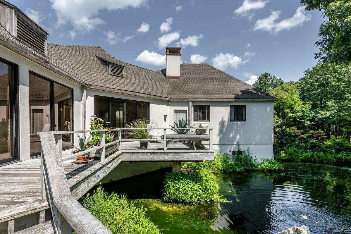 The deck on the home on 114 Seherr Thoss Drive in Litchfield, Conn. has a brook in its backyard. 