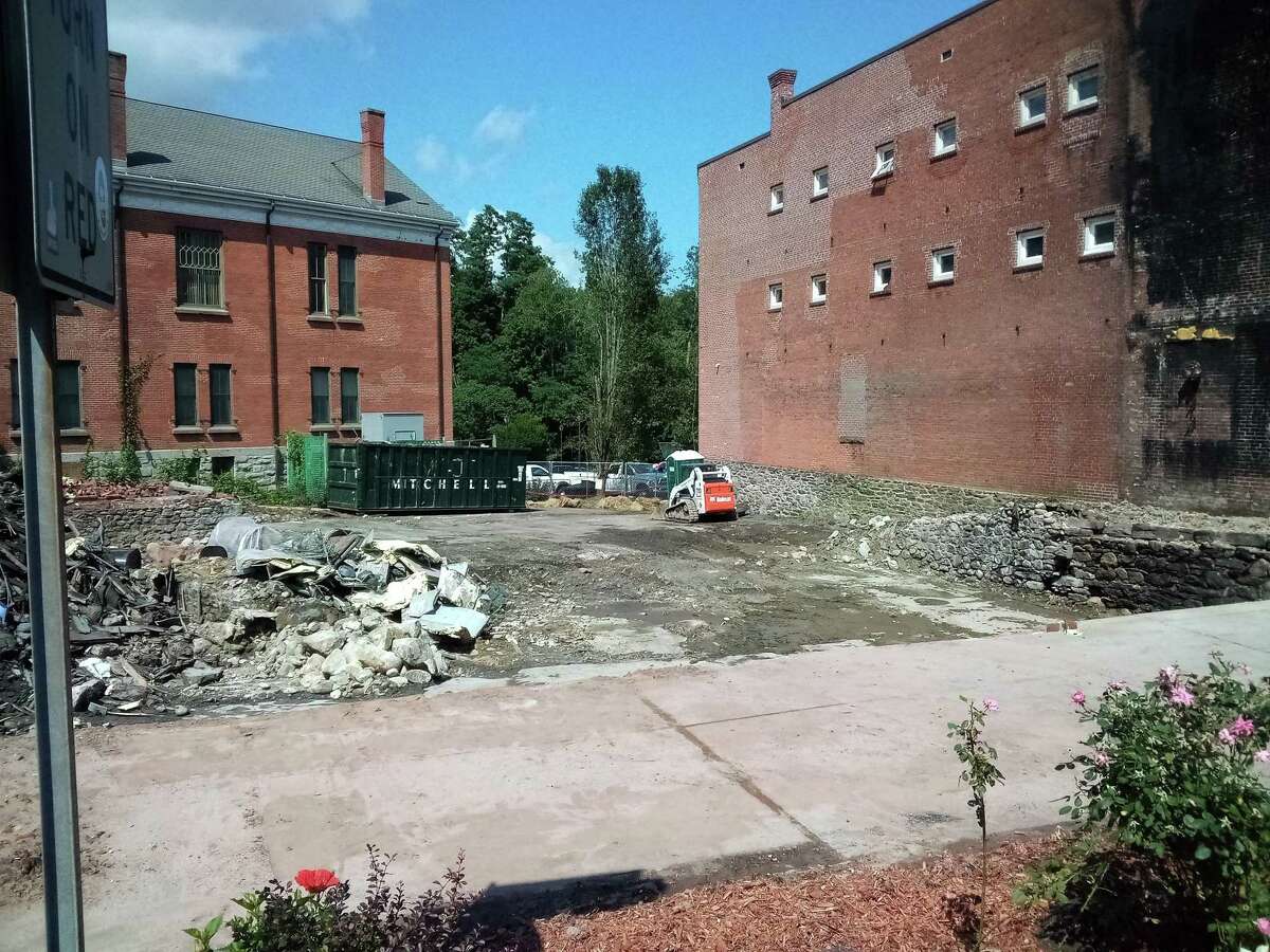 The New Hartford House, which was destroyed in a three-alarm fire Aug. 10, was demolished the following day. The area of the building is fenced in and most of the debris has been removed.