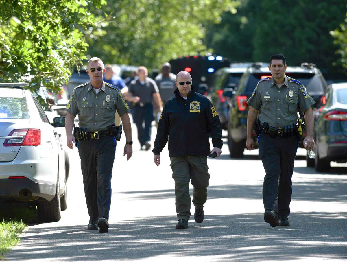 Connecticut State Police and local police and fire units were on River Bend Drive in Woodbury, Conn, after a veteran Connecticut State Police sergeant was killed Thursday after officials say his vehicle was swept away by floodwaters during Ida. Thursday, September 2, 2021.