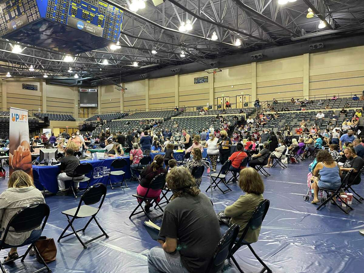 A packed crowd at housing, utility and legal assistance clinic at St. Mary’s University Saturday.