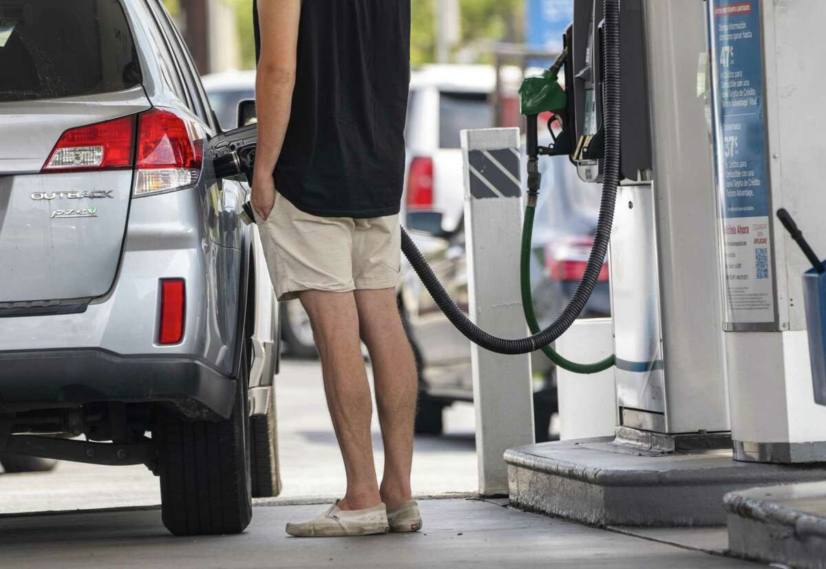 A motorist pumps gasoline at a gas station in downtown Los Angeles, California, U.S., on Thursday, July 8, 2021. According to AAA, the average price of regular gasoline in California is $4.308, with some gas stations nearing $6 per gallon. Photographer: Kyle Grillot/Bloomberg