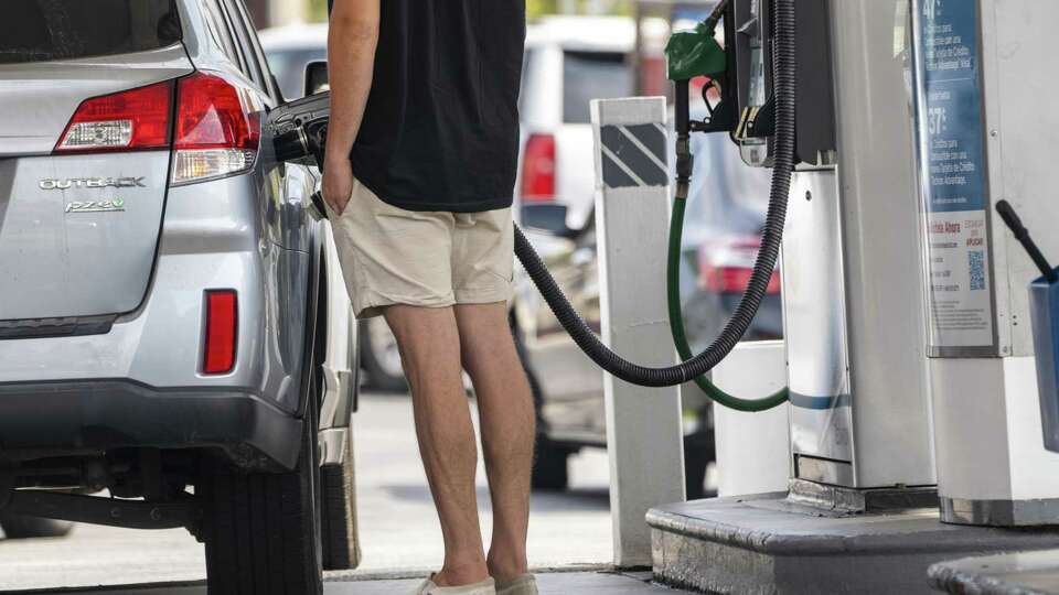 A motorist pumps gasoline at a gas station in downtown Los Angeles, California, U.S., on Thursday, July 8, 2021. According to AAA, the average price of regular gasoline in California is $4.308, with some gas stations nearing $6 per gallon. Photographer: Kyle Grillot/Bloomberg