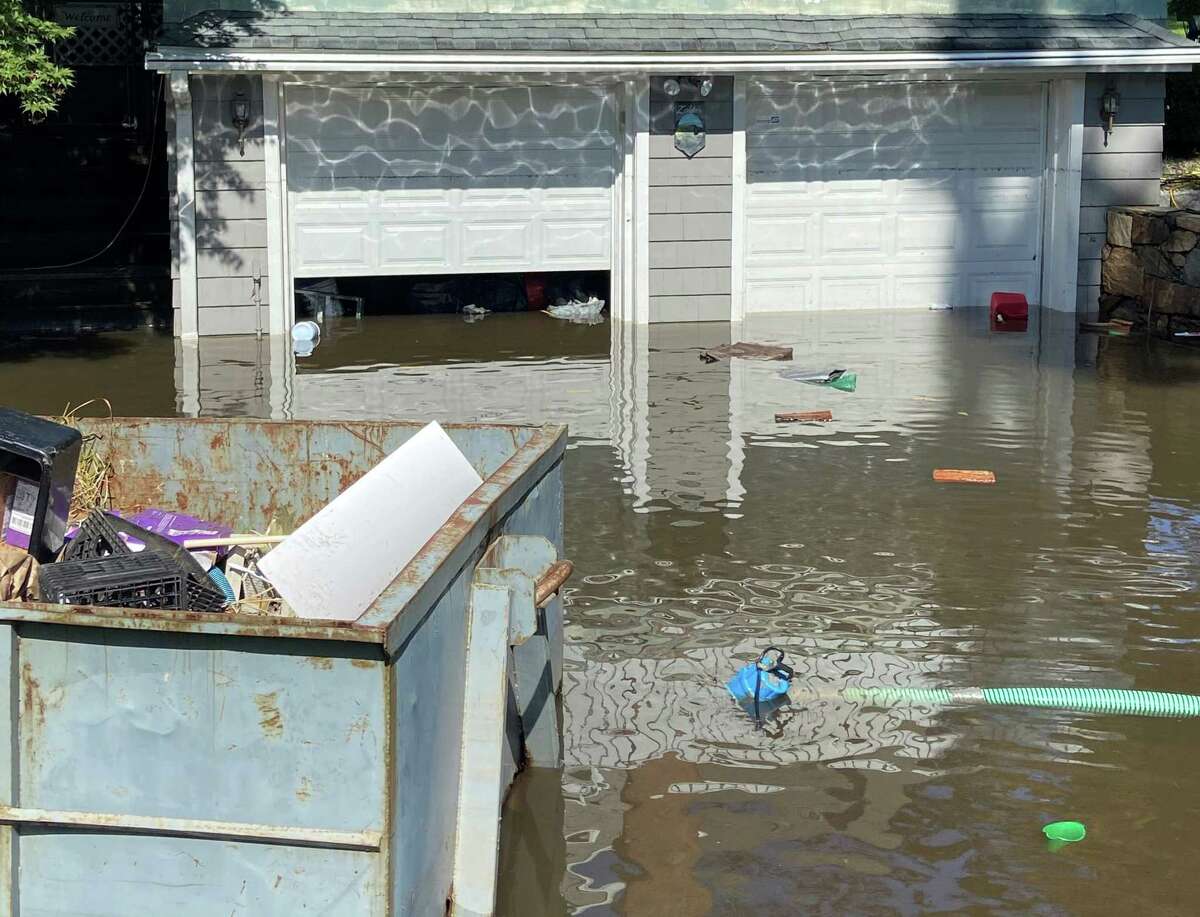 Remnants from Hurricane Ida flooded driveway/garage on Lewis Drive in Farifield on Sept. 2, 2021.
