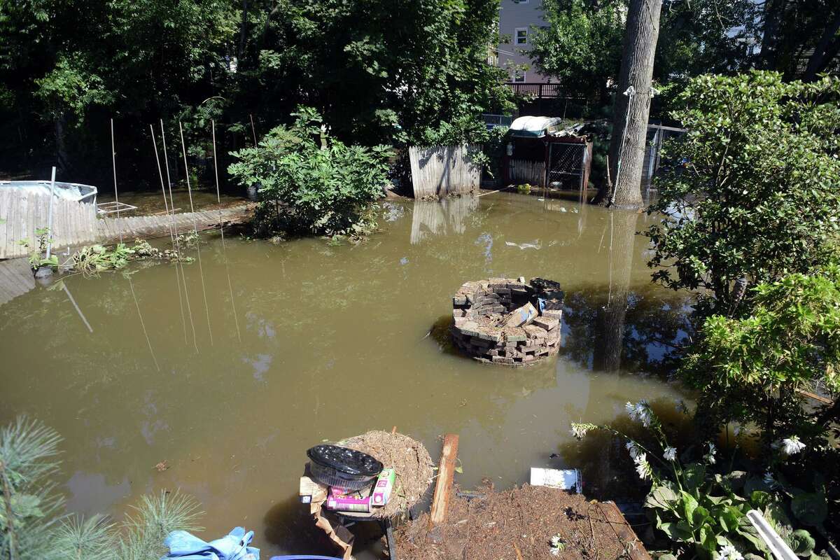 A flooded backyard behind a home on Renwick Place, in Bridgeport, Conn. Sept. 2, 2021. The neighborhood was flooded when heavy rains brought in from the remnants of Hurricane Ida caused flooding along the Rooster River.