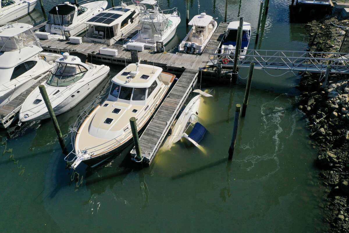 A boat sank at its slip at Norwalk Cover Marina after remnants of Ida hit Connecticut overnight on Thursday, Sept. 2, 2021.