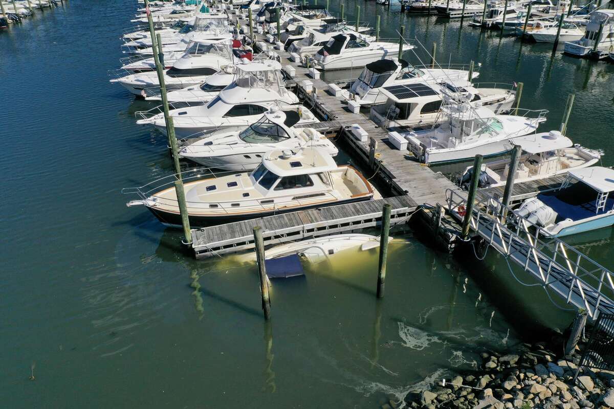 A boat sank at its slip at Norwalk Cover Marina after remnants of Ida hit Connecticut overnight on Thursday, Sept. 2, 2021.