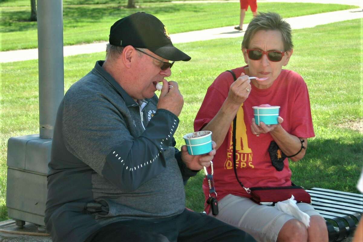 Ferris State University students and staff gathered in Robinson Quad for a resource fair and ice cream social Thursday afternoon. The event was part of the university's annual Founder's Day celebration. (Pioneer photo/Cathie Crew)