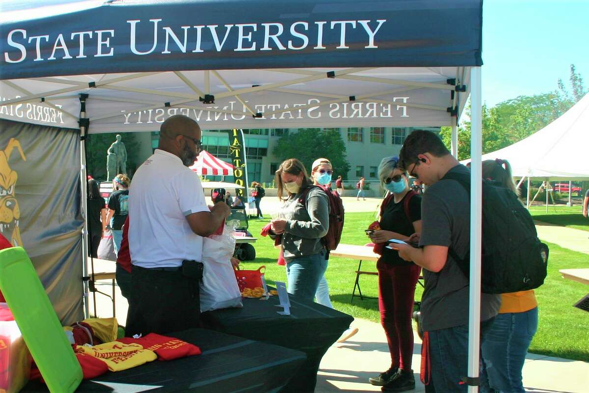 Ferris State University students and staff gathered in Robinson Quad for a resource fair and ice cream social Thursday afternoon. The event was part of the university's annual Founder's Day celebration. (Pioneer photo/Cathie Crew)