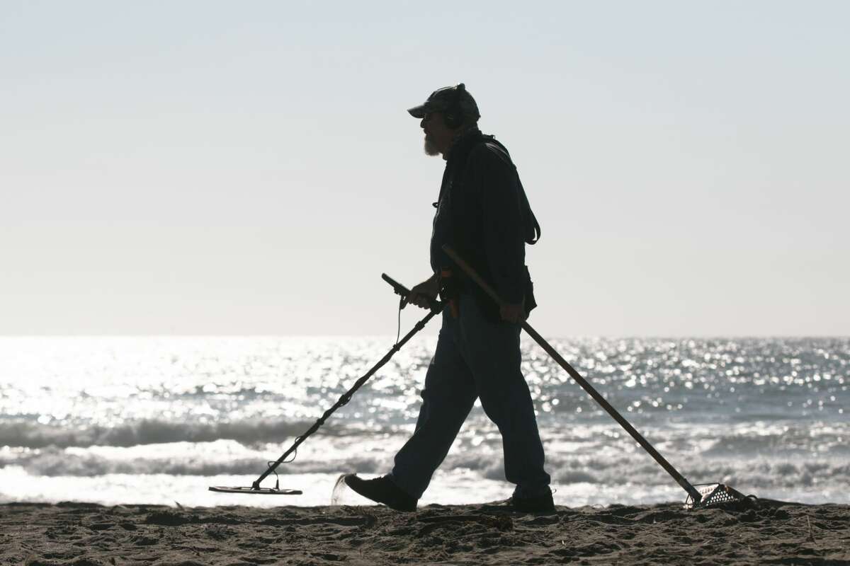 Metal detector Marshall Smith is performing some recreational metal searches on a trip to Ocean Beach, San Francisco on August 26, 2021.
