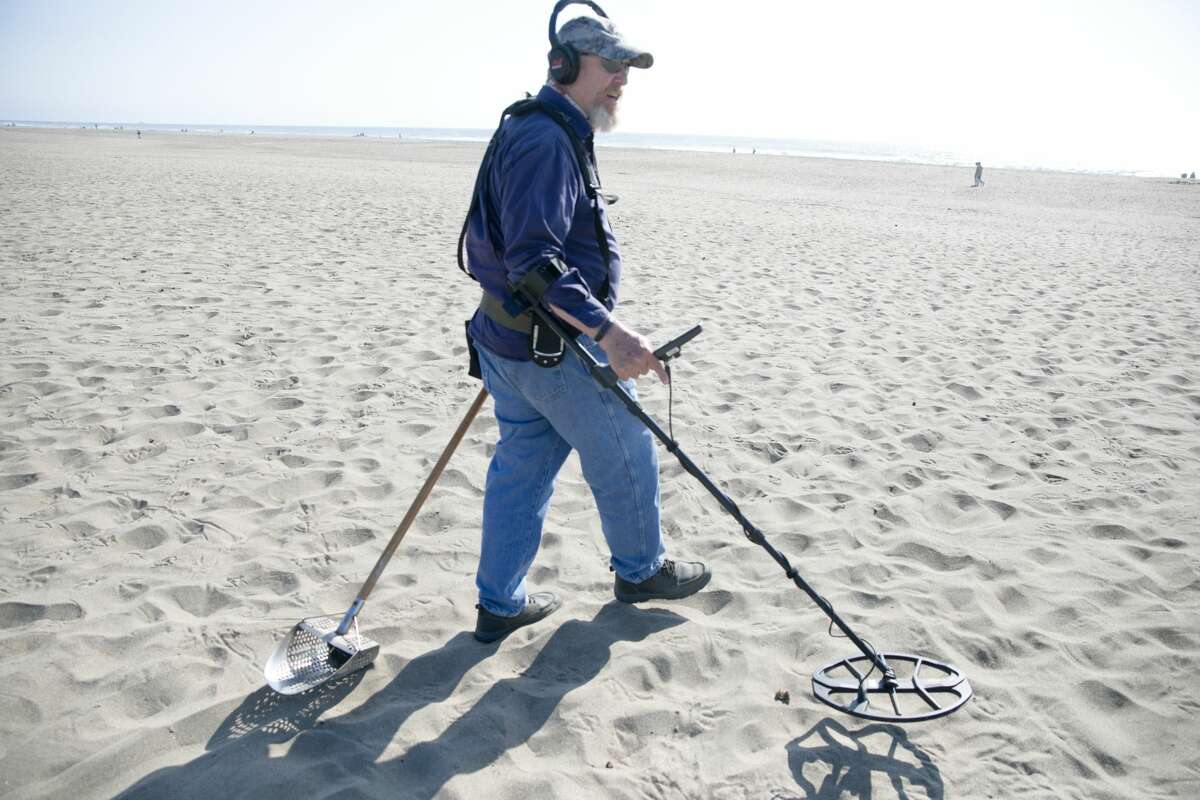 Metal detector Marshall Smith is performing some recreational metal searches on a trip to Ocean Beach, San Francisco on August 26, 2021.