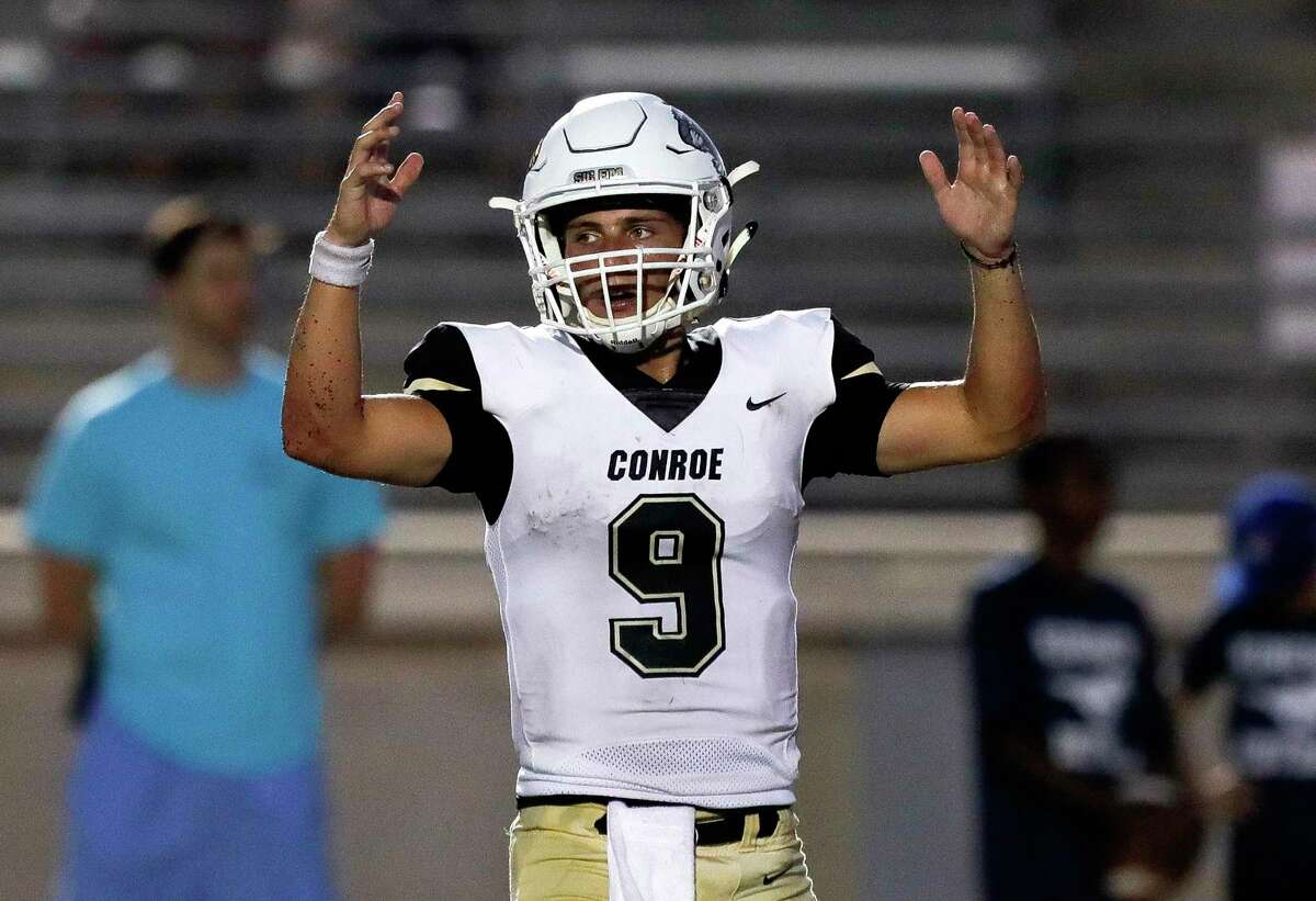 Conroe starting quarterback Clayton Garlock (9) reacts after a 8-yard touchdown from Thomas Jackson during the second quarter of a non-district high school football game at Turner Stadium, Thursday, Sept. 2, 2021, in Humble.