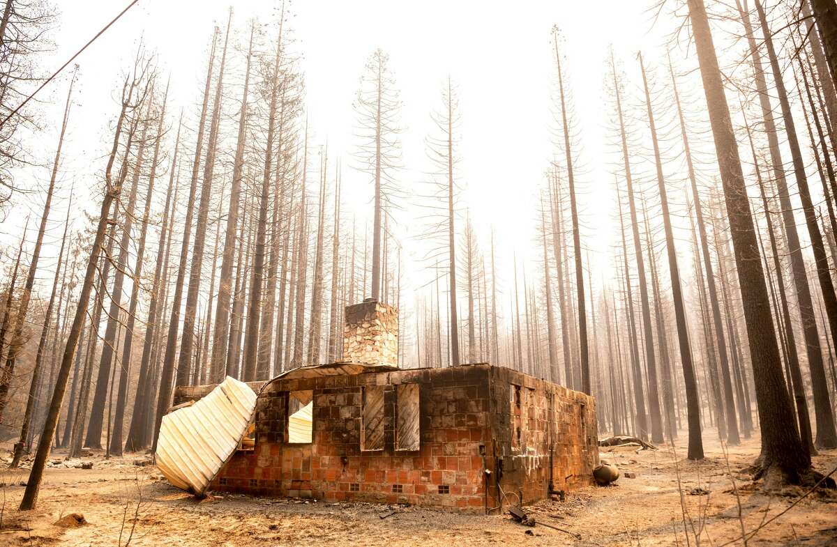 The remains of a house burned during the Caldor fire in Twin Bridges, California, on September 1, 2021. At least 650 structures were burned and thousands more are threatened during the Caldor fire moving to the resort community in South Lake Tahoe, California. .
