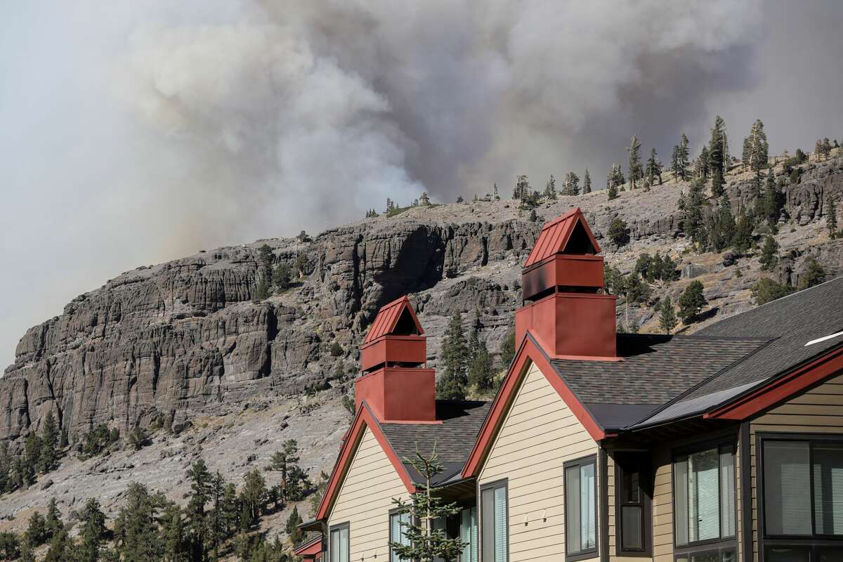 Smoke from the Caldor Fire rose on a ridge near the Kirkwood Mountain Resort in Kirkwood, California, on Wednesday, September 1, 2021.