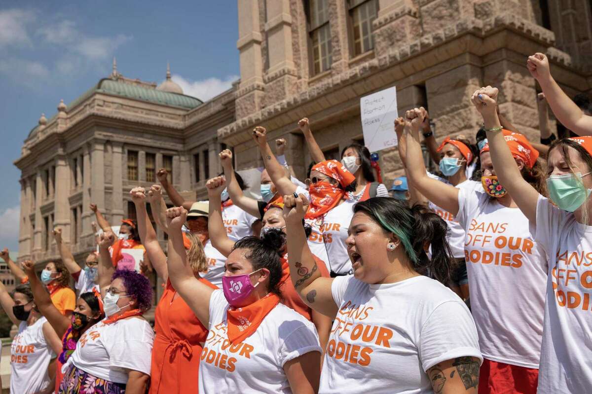 Women protest Wednesday against the six-week abortion ban at the Capitol in Austin. A reader notes Texas won’t regulate guns, or mandate masks for kids in schools, but it will regulate women’s health.