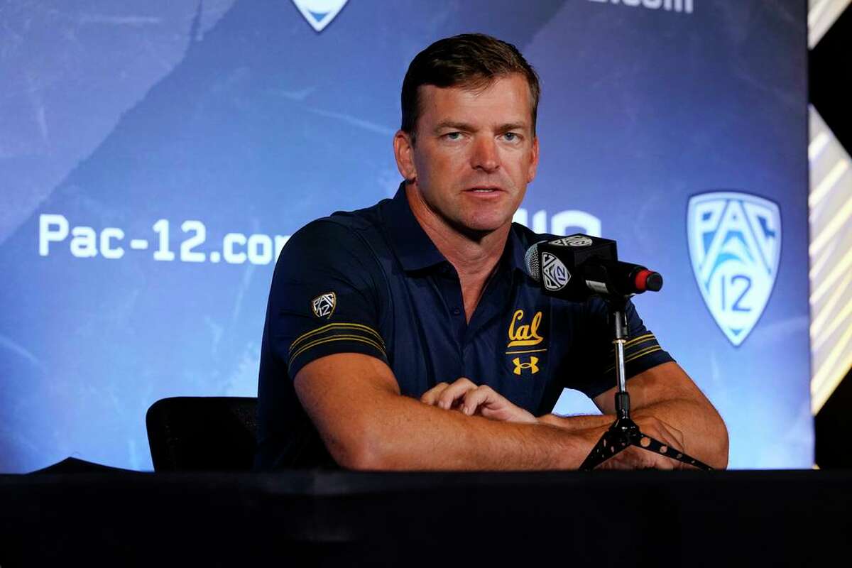 FILE - In this July 27, 2021, file photo, California head coach Justin Wilcox fields questions during the Pac-12 Conference NCAA college football Media Day in Los Angeles. After a pandemic-shortened 2020 season, the California Golden Bears are excited to show off what they hope will be a much more dynamic offense with respected longtime NFL coordinator Bill Musgrave and veteran quarterback Chase Garbers. Coach Justin Wilcox brought on Musgrave last season to build on a strong finish to 2019 only to have spring practice cut short after only a few sessions because of the COVID-19 pandemic. (AP Photo/Marcio Jose Sanchez, File)